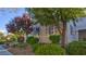The front of the house is adorned with trees and shrubbery, providing privacy and enhancing curb appeal at 1869 Bronze Patina St, Henderson, NV 89044