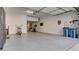 Clean, organized garage space with epoxy floors, ample storage, and room for multiple vehicles at 1869 Bronze Patina St, Henderson, NV 89044