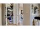 Hallway featuring a closet with ample storage, a view to a cozy bedroom, and stylish decor at 1869 Bronze Patina St, Henderson, NV 89044