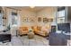 Comfortable living room featuring a plush sofa, decorative pillows, and ample natural light at 1869 Bronze Patina St, Henderson, NV 89044