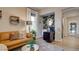 Stylish living room with a comfortable sofa, decorative accents, and a dedicated workspace at 1869 Bronze Patina St, Henderson, NV 89044