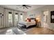 Inviting main bedroom with large windows, plush bedding, and serene decor, providing a tranquil retreat at 1869 Bronze Patina St, Henderson, NV 89044