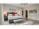 Comfortable main bedroom featuring a large bed, soft lighting, and access to a walk-in closet for added convenience at 1869 Bronze Patina St, Henderson, NV 89044
