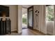Bedroom featuring a dresser and exterior door, seamlessly blending indoor comfort with outdoor accessibility and natural light at 1869 Bronze Patina St, Henderson, NV 89044