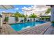 Refreshing pool with brick trim, water feature and patio area, perfect for outdoor relaxation at 1869 Bronze Patina St, Henderson, NV 89044