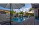 Inviting pool with pergola and a view of the beautiful backyard on a sunny day at 1869 Bronze Patina St, Henderson, NV 89044