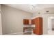Bedroom with wood-style built in cabinets and desk at 2143 Vista Famosa Ct, Las Vegas, NV 89123