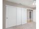 Bedroom features sliding closet doors and neutral color palette at 2143 Vista Famosa Ct, Las Vegas, NV 89123