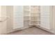 Walk in closet featuring white closet organization system with shelving and drawers at 2143 Vista Famosa Ct, Las Vegas, NV 89123