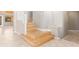 Elegant wood staircase with tile landing and neutral wall color at 2143 Vista Famosa Ct, Las Vegas, NV 89123