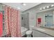 Full bathroom with strawberry curtain, shower-tub combination, and granite countertops at 2451 N Rainbow Blvd # 2076, Las Vegas, NV 89108