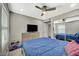 Comfortable bedroom with a ceiling fan, tv and a mirrored closet at 2451 N Rainbow Blvd # 2076, Las Vegas, NV 89108