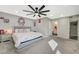 Relaxing main bedroom with a cozy carpet, a ceiling fan, and an attached en-suite bathroom at 2451 N Rainbow Blvd # 2076, Las Vegas, NV 89108