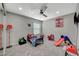 Brightly lit bedroom with a ceiling fan, a window, and carpeted floors with decorations at 2451 N Rainbow Blvd # 2076, Las Vegas, NV 89108