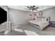 Bright bedroom featuring a large window, ceiling fan, and modern decor at 2451 N Rainbow Blvd # 2076, Las Vegas, NV 89108