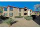 Apartment complex exterior with two stories, balconies and desert landscaping at 2451 N Rainbow Blvd # 2076, Las Vegas, NV 89108