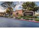 Alondra Condominium Homes entrance featuring mature trees, landscaping, and a welcoming sign at 2451 N Rainbow Blvd # 2076, Las Vegas, NV 89108