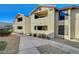 Charming condo complex featuring stucco siding and tile roof, with easy access to parking and landscaped grounds at 2451 N Rainbow Blvd # 2076, Las Vegas, NV 89108