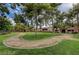 Lush green space with mature trees and walking paths, offering a serene outdoor environment at 2451 N Rainbow Blvd # 2076, Las Vegas, NV 89108