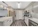 Modern kitchen featuring sleek cabinetry, stainless steel appliances, and an island with a stylish pendant lighting at 2451 N Rainbow Blvd # 2076, Las Vegas, NV 89108