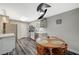 Bright kitchen featuring stainless steel appliances, white subway tile backsplash, and adjacent wooden dining table at 2451 N Rainbow Blvd # 2076, Las Vegas, NV 89108