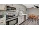 Stylish kitchen featuring stainless appliances, modern backsplash and a cozy breakfast nook with natural light at 2451 N Rainbow Blvd # 2076, Las Vegas, NV 89108