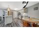 Bright kitchen area featuring stainless steel appliances and an adjacent wooden dining table at 2451 N Rainbow Blvd # 2076, Las Vegas, NV 89108