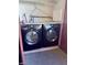 Laundry area featuring modern, dark-colored, front-load washing machine and dryer at 2451 N Rainbow Blvd # 2076, Las Vegas, NV 89108
