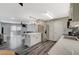 Bright, modern kitchen seamlessly connected to the dining and living room in an open floor plan at 2451 N Rainbow Blvd # 2076, Las Vegas, NV 89108