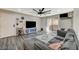 Comfortable living room featuring wood floors, a ceiling fan, and plenty of space for relaxing and entertaining at 2451 N Rainbow Blvd # 2076, Las Vegas, NV 89108