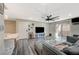 Inviting living room featuring wood floors, neutral tones, a ceiling fan and access to a private balcony at 2451 N Rainbow Blvd # 2076, Las Vegas, NV 89108