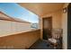 Covered patio with dark floor covering, rocking chair and a view of the building at 2451 N Rainbow Blvd # 2076, Las Vegas, NV 89108