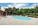 Community pool with sun loungers, providing residents a relaxing space to enjoy the outdoors at 2451 N Rainbow Blvd # 2076, Las Vegas, NV 89108