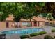 Community pool with lounge chairs and lush landscaping creating a tranquil outdoor oasis at 2451 N Rainbow Blvd # 2076, Las Vegas, NV 89108
