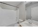 Bathroom featuring a shower and bath tub combo, sink with chrome faucet, and a toilet at 2586 Begonia Valley Ave, Henderson, NV 89074