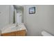 Half bathroom featuring marble countertop and framed art at 2586 Begonia Valley Ave, Henderson, NV 89074