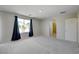 Bedroom with carpet, a large window, and ensuite bathroom at 2586 Begonia Valley Ave, Henderson, NV 89074