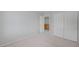 Bedroom featuring plush carpeting, neutral walls, a closet with sliding doors, and electrical outlets at 2586 Begonia Valley Ave, Henderson, NV 89074