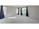 Bright bedroom with carpet, natural light, and decorative curtains at 2586 Begonia Valley Ave, Henderson, NV 89074