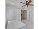 Bright bedroom with ceiling fan shows doorway into home at 2586 Begonia Valley Ave, Henderson, NV 89074