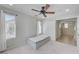 Neutral bedroom with carpet and ceiling fan showcases entry to hallway at 2586 Begonia Valley Ave, Henderson, NV 89074