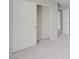 Walk-in closet with carpet floor and white sliding doors and a built-in wire rack at 2586 Begonia Valley Ave, Henderson, NV 89074