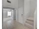 Inviting entryway with tiled floor leads to carpeted stairs and living space at 2586 Begonia Valley Ave, Henderson, NV 89074