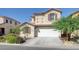 Attractive two-story home showcasing a clean two-car garage and desert-friendly landscaping at 2586 Begonia Valley Ave, Henderson, NV 89074