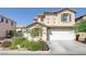 Charming two-story home with a well-manicured front yard and attached two car garage at 2586 Begonia Valley Ave, Henderson, NV 89074