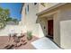 Charming front entrance featuring a cozy outdoor seating area and a well-maintained walkway at 2586 Begonia Valley Ave, Henderson, NV 89074