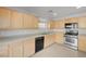 Efficient kitchen with ample wood cabinets, stainless steel appliances, and neutral countertops at 2586 Begonia Valley Ave, Henderson, NV 89074