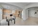 Well-lit kitchen with stainless steel appliances, wooden cabinets, and a dining area with a glass table at 2586 Begonia Valley Ave, Henderson, NV 89074
