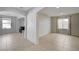 Bright living room features tile flooring, neutral paint, and plenty of natural light at 2586 Begonia Valley Ave, Henderson, NV 89074