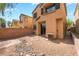 A cozy backyard featuring a desert landscape with rocks and pavers, perfect for low-maintenance outdoor living at 28 Yellow Flame Ave, North Las Vegas, NV 89084